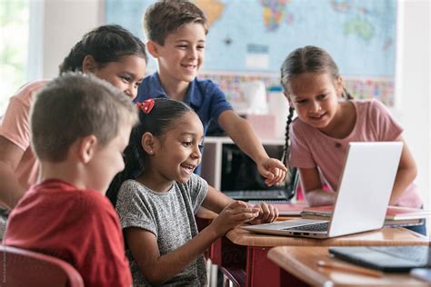 School Kids Laughing At Funny Online Video By Stocksy Contributor