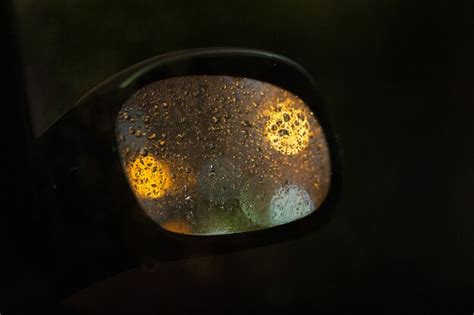 Premium Photo | Rear view mirror of a car in the rain