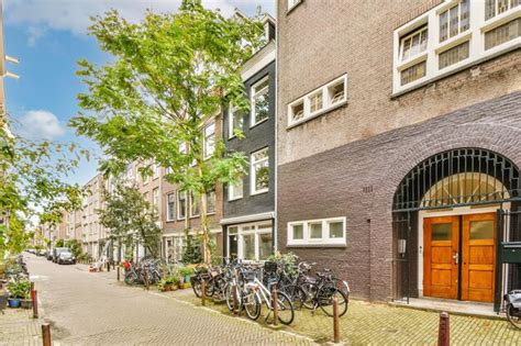 Premium Photo A Row Of Bikes Parked Outside A Brick Building