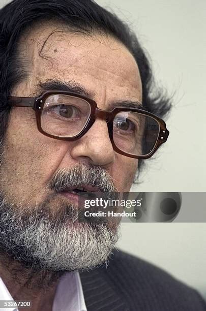 Saddam Hussein Appears At Tribunal In Iraq Photos and Premium High Res ...