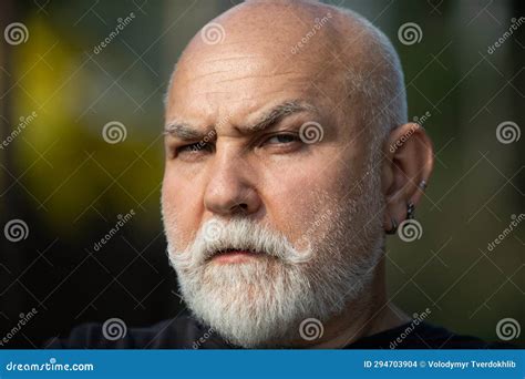Close Up Portrait Of Serious Senior Man Outdoor Mature Man With
