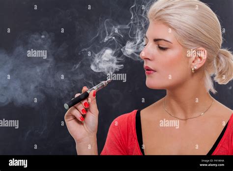 Woman Smoking Cigarette Exhaling Tobacco Hi Res Stock Photography And