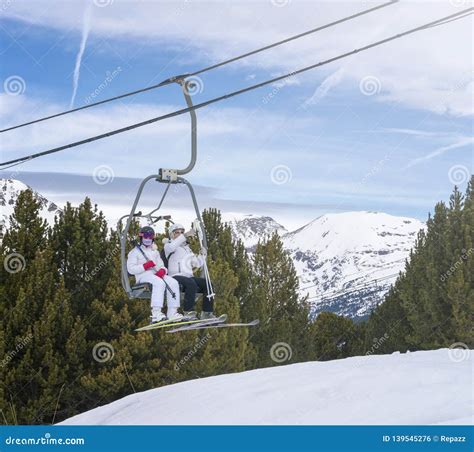Skiers in Ski Resort Transportation Chairlift Editorial Photo - Image