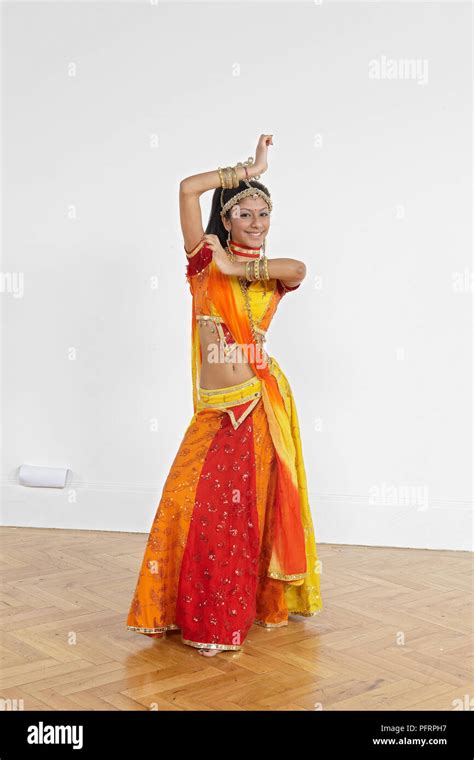 Teenage girl performing Bollywood dance move Stock Photo - Alamy