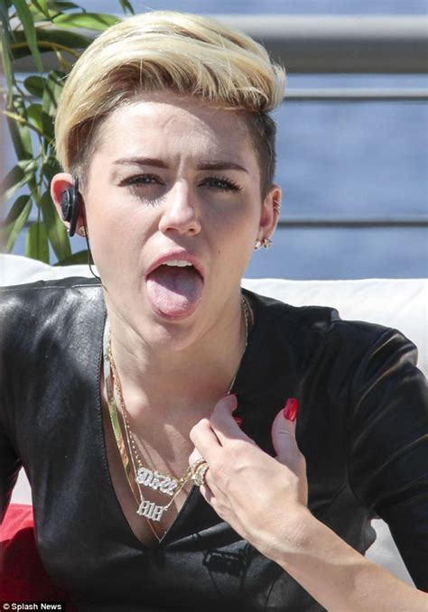 Miley Cyrus Looks Literally Hot As She Tours Berlin Wearing A Tight Leather Dress Daily Mail