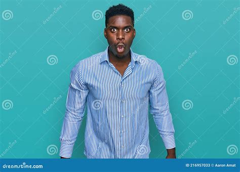 Handsome Business Black Man Wearing Casual Striped T Shirt Scared And