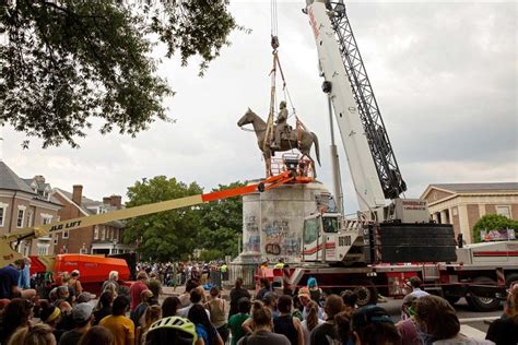 People Watch As The Stonewall Jackson Statue Is Removed From Monument Avenue In Richmond Va