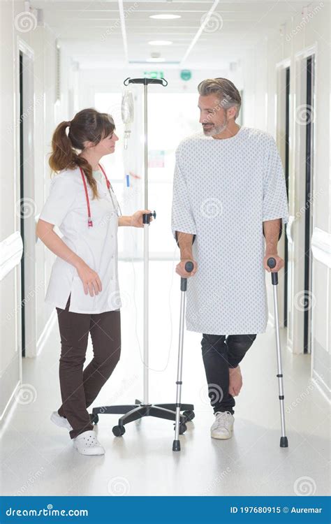 Patient Using Cane while Looking at Female Doctor Stock Image - Image of center, patient: 197680915