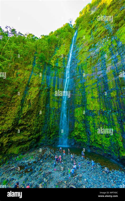 People Enjoying The Water Of Wailua Falls On The Road To Hana Maui