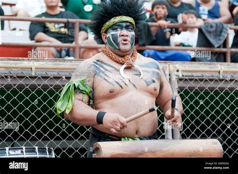 Hawaii mascot beats the drums during the first half in the game between the Boise State Broncos ...