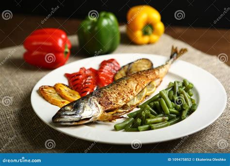 Healthy And Proper Food Grilled Fish And Vegetables Stock Photo