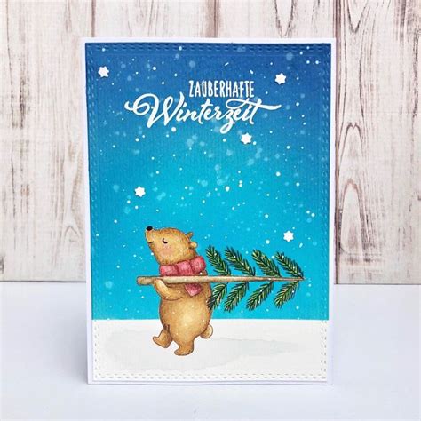 A Handmade Christmas Card With A Bear Holding A Pine Branch