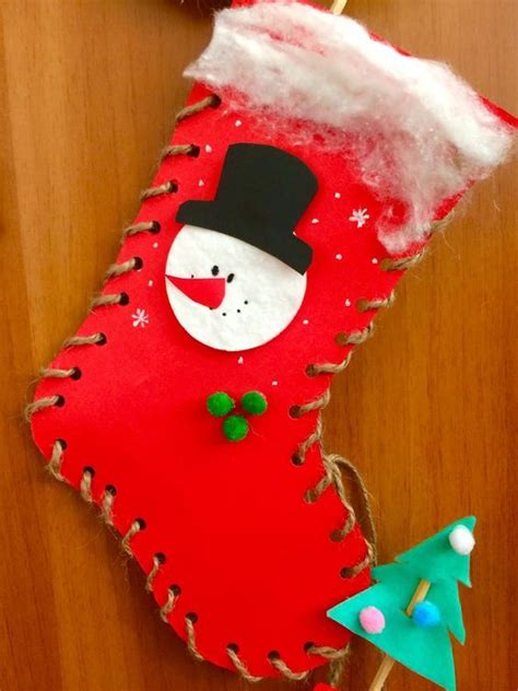 A Red Christmas Stocking With A Snowman On It