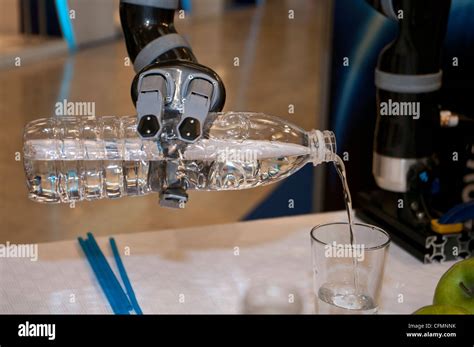 Jaco Robot Arm From Kinova Robotics Company Drops Water In A Glass In