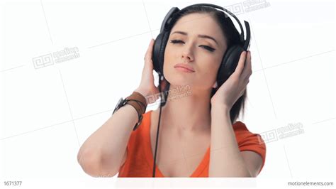 Young Beautiful Sexy Girl Listening To Music On Headphones Stock Video Footage 1671377