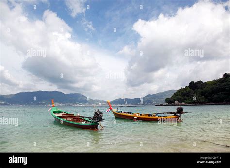 Traditional Thai Long Tailed Boats In The Bay Of Patong Beach In Patong