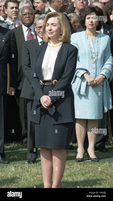 First Lady Hillary Clinton Listens As U S President Bill Clinton And