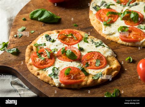 Mozarella Basil And Tomato Flatbread Pizza On Naan Bread Stock Photo