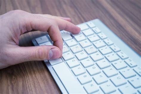 Finger Pressing Alt Tab Command On The White Wireless Keyboard Stock