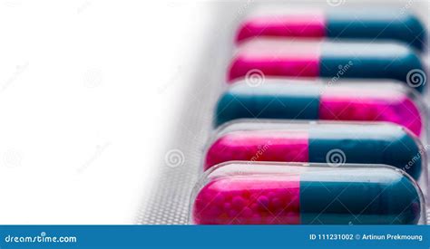 Selective Focus of Blue, Pink Capsule with Granule in Side Pills. Pills in Blister Pack on White ...