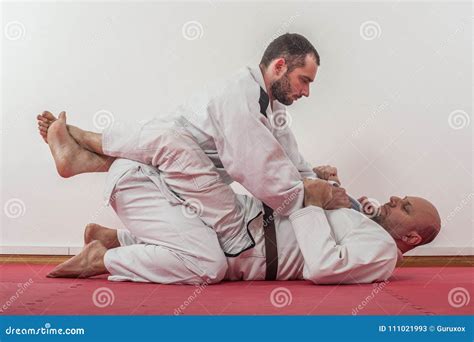 Brazilian Jiu Jitsu Training Demonstration In Traditional Kimono Stock