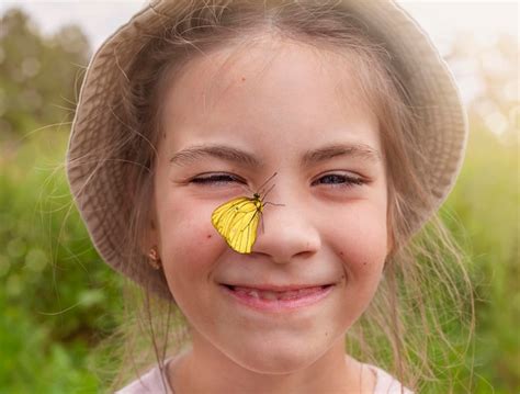 Premium Photo Portrait Of A Girl With A Butterfly On Her Nose