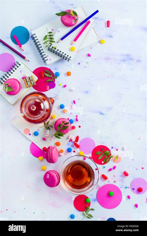 Glass Teapot With Candies And Confetti On A Light Background With Copy