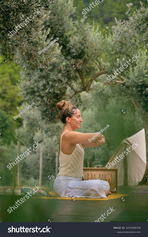 Стоковая фотография 2255269339 Side View Woman Sitting Pose Meditating