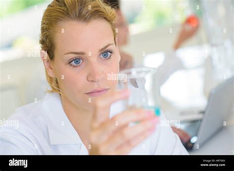 Female Technician Holding Glass Flask Stock Photo Alamy