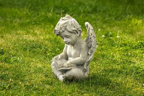 Royalty-Free photo: Concrete cherub statue during daytime | PickPik