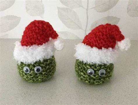 Two Crocheted Green And White Christmas Slippers With Googly Eyes One