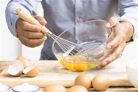 Man Whisking Egg In His Kitchen Stock Image Image Of Caucasian Bundt