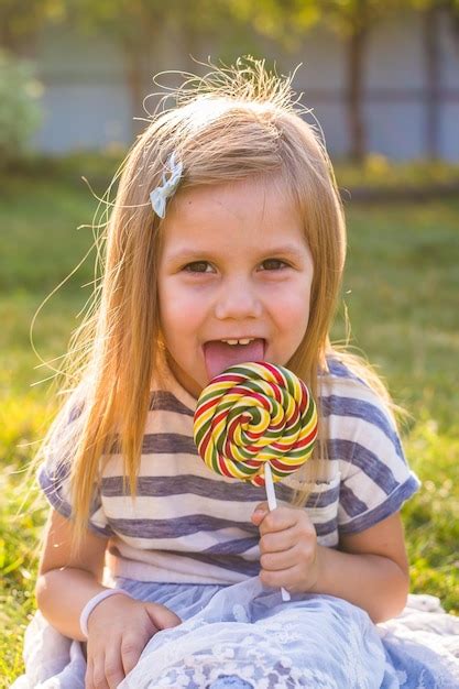 Premium Photo Portrait Of Cute Girl Holding Ice Cream