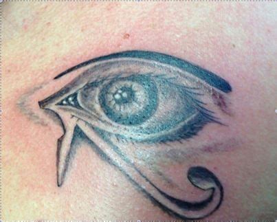 An Eye Tattoo On The Back Of A Woman S Shoulder