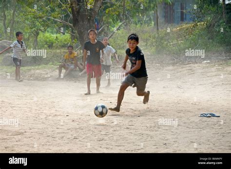 Burmese Refugee Children In Thailand Playing Football Stock Photo Alamy