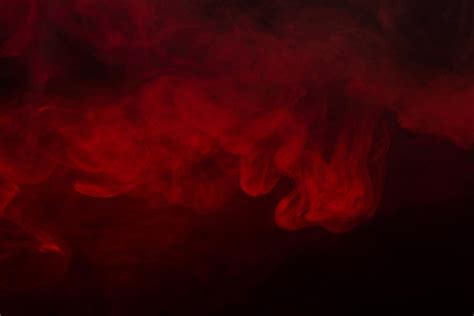 Premium Photo Red Steam On A Black Background