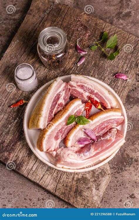 Raw Pork Belly With Rind Peritoneum Meat Spices And Herbs Stock Photo