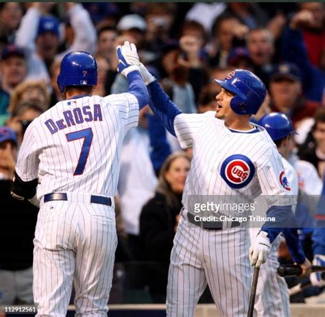 The Chicago Cubs' Mark DeRosa is congratulated by teammate Ryan... News Photo - Getty Images