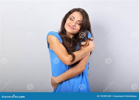 Happy Sporty Woman Hugging Herself With Natural Emotional Enjoyi Stock