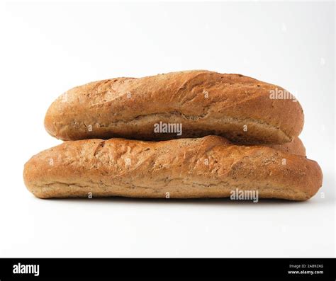 Stack Of Whole Baked Baguettes From Rye Flour On A White Background