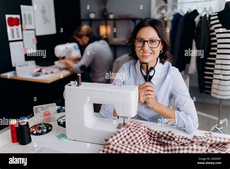 Seamstress With Sewing Machine At Work Stock Photo Alamy