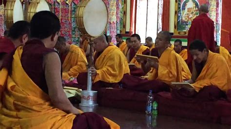 Monks At Gaden Shartse Monastery Chanting And Playing Drums In A