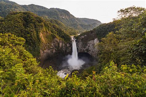 Aerial Photo Of A Waterfall Falling Into A Lake By Stocksy