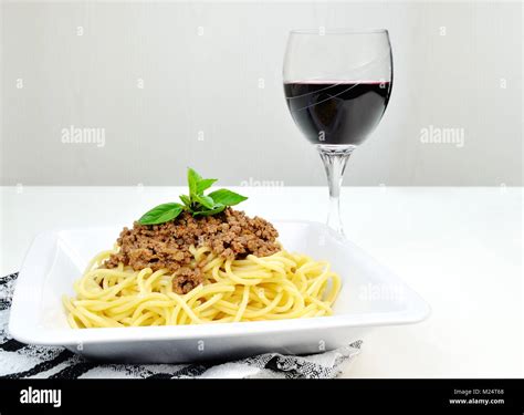 Spaghetti Bolognese And A Glass Of Red Wine Stock Photo Alamy