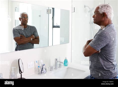 Man Looking In Mirror Sad