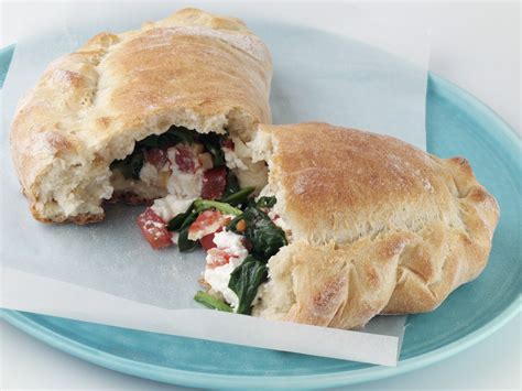 Calzone Filled With Mozzarella Tomatoes And Spinach Recipe Eat