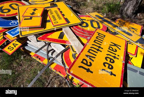 Messy Inventory Pile Of Finnish Traffic Signs Lying On The Ground