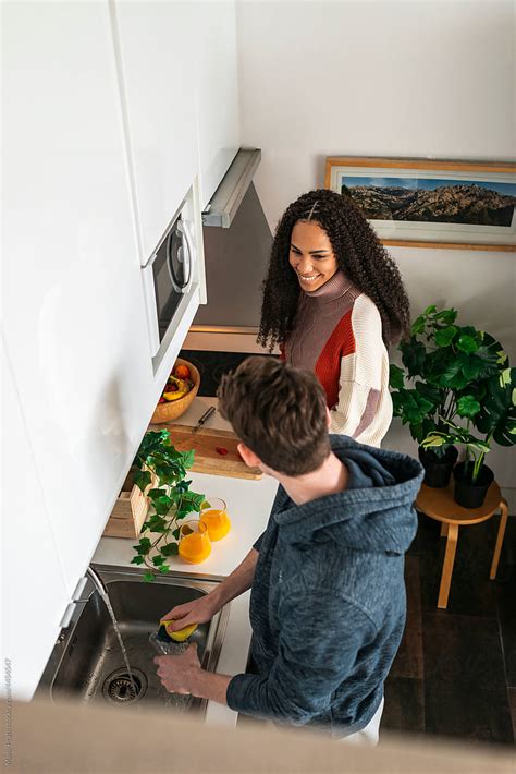 Multiracial Couple Preparing Breakfast By Stocksy Contributor Manu