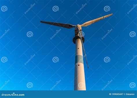 Old Abandoned Wind Turbines In The Desert Landscape Stock Photo