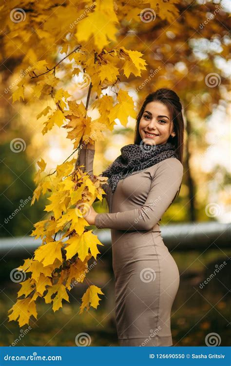 Beautiful Autumn Woman With Autumn Leaves On Fall Nature Background